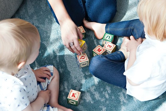 Child playing and learning in a nurturing home-based childcare environment