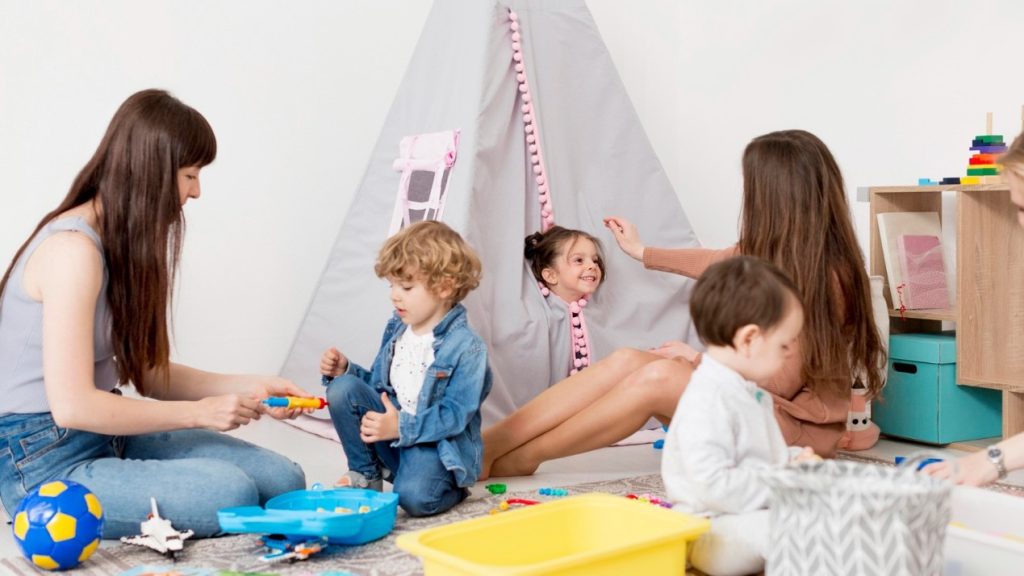 Children playing and learning together in a nurturing Auckland childcare environment, reflecting New Zealand's unique early childhood education approach.